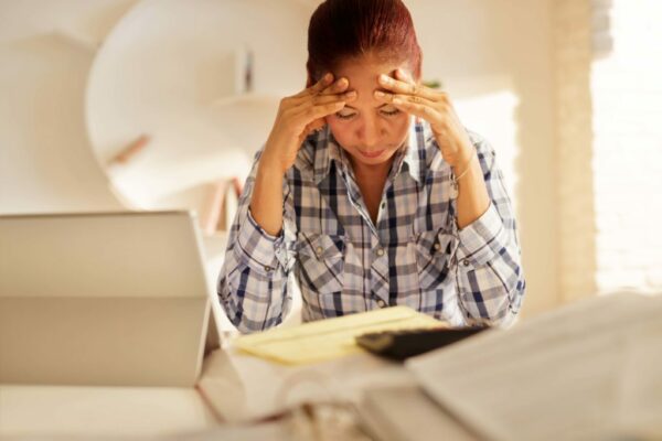 Angry Senior Woman Paying Bills And Filing Federal Tax Return
